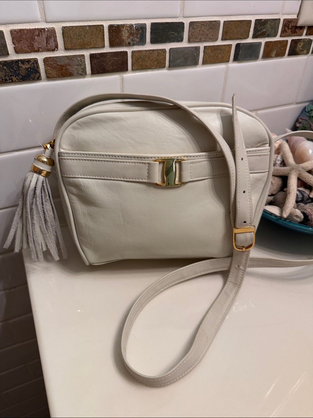Tignanello Ivory Leather Crossbody with Gold Hardware and Tassel